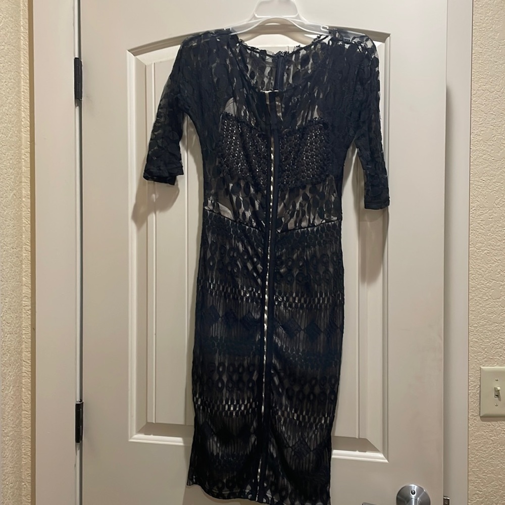 Black lace midi length dress. 3 quarter length sleeves. Size M.